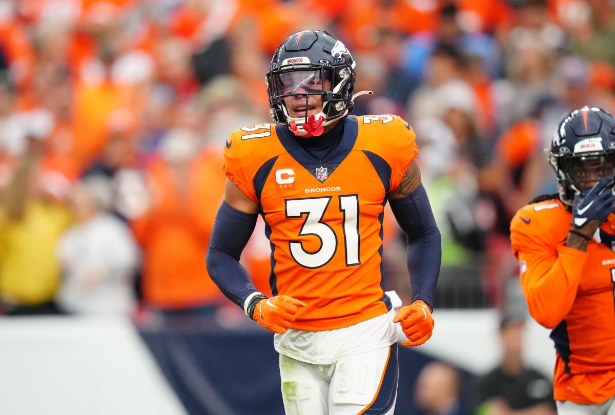 Denver Broncos safety Justin Simmons (31) reacts to a turnover in the third quarter against the Las Vegas Raiders at Empower Field at Mile High.