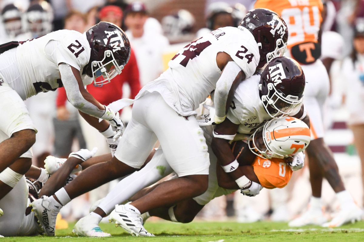 Oct 14, 2023; Knoxville, TN, USA; Tennessee running back Jaylen Wright (0) is tackled by multiple Texas A&M players during a football game between Tennessee and Texas A&M at Neyland Stadium in Knoxville, Tenn., on Saturday, Oct. 14, 2023.