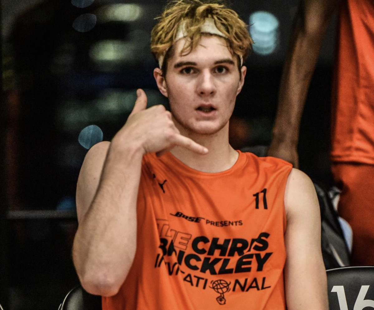 The phone call gesture has become a trademark celebration for Indiana basketball commit Liam McNeeley.