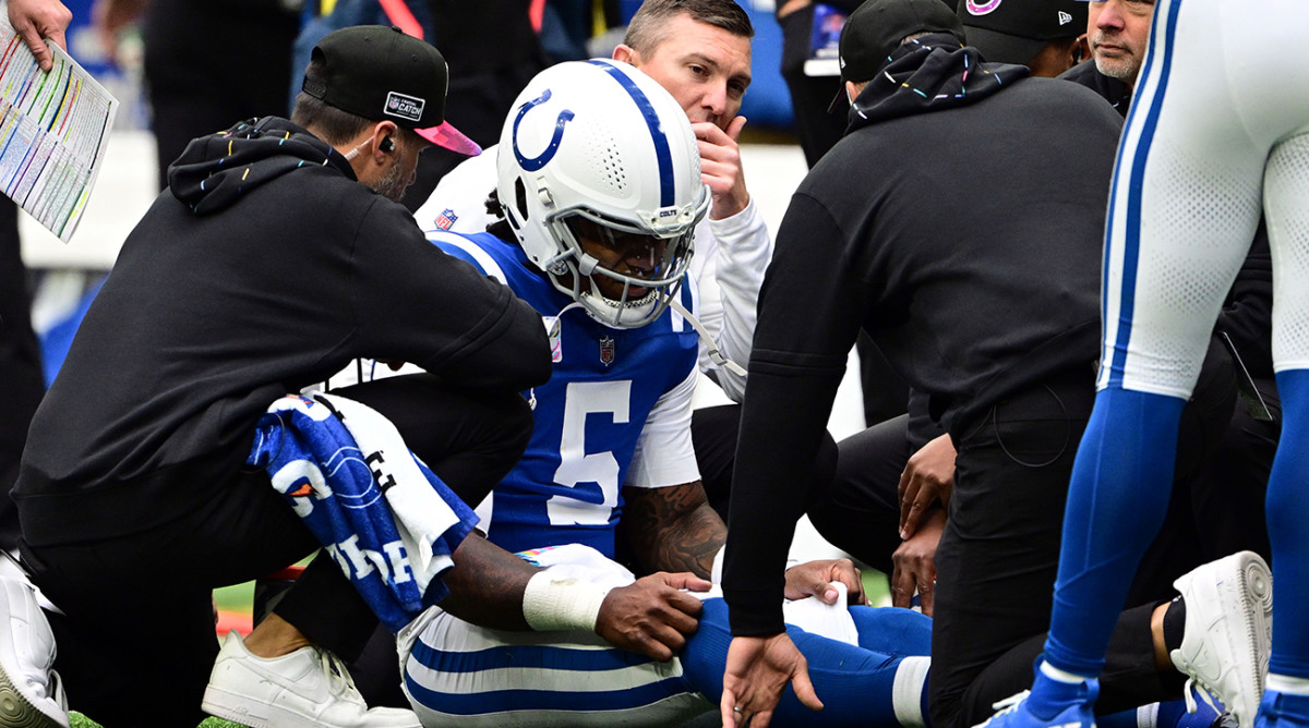 Colts quarterback Anthony Richardson (5) sits on the field with a shoulder injury during the second quarter against the Titans at Lucas Oil Stadium.