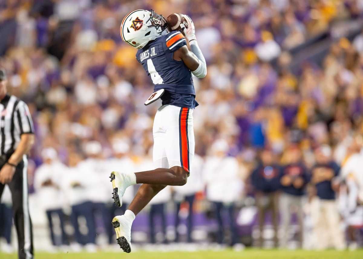Auburn cornerback DJ James 4 makes an interception as the LSU Tigers take on the Auburn Tigers at Tiger Stadium in Baton Rouge, Louisiana, Saturday, Oct. 14, 2023.  