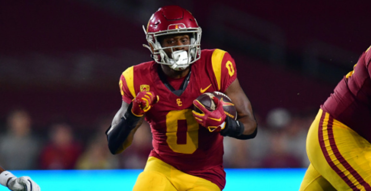 USC Trojans running back MarShawn Lloyd on a rushing attempt during a college football game.