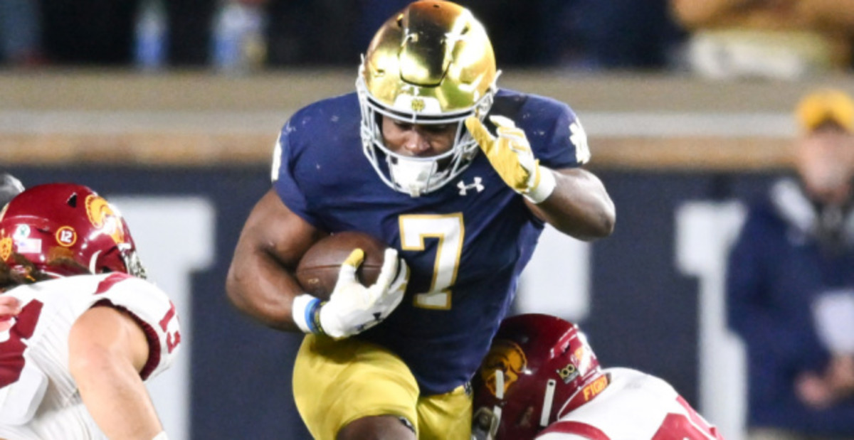 Notre Dame Fighting Irish running back Audric Estime on a rushing attempt during a college football game.