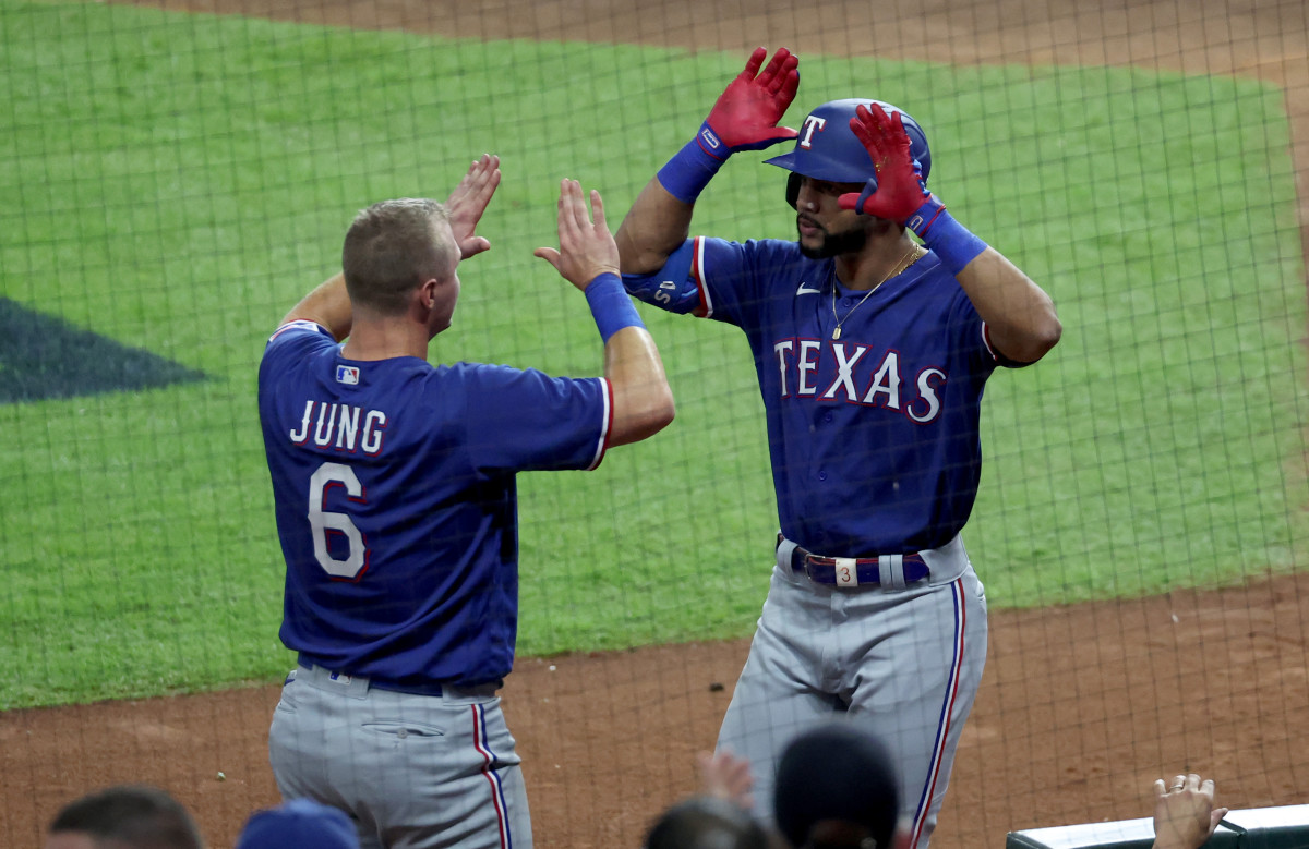 Texas Rangers center fielder Leody Taveras, right, celebrates with third baseman Josh Jung after hitting a home run during the fifth inning of Game 1 of the ALCS Sunday night against the Houston Astros at Minute Maid Park.