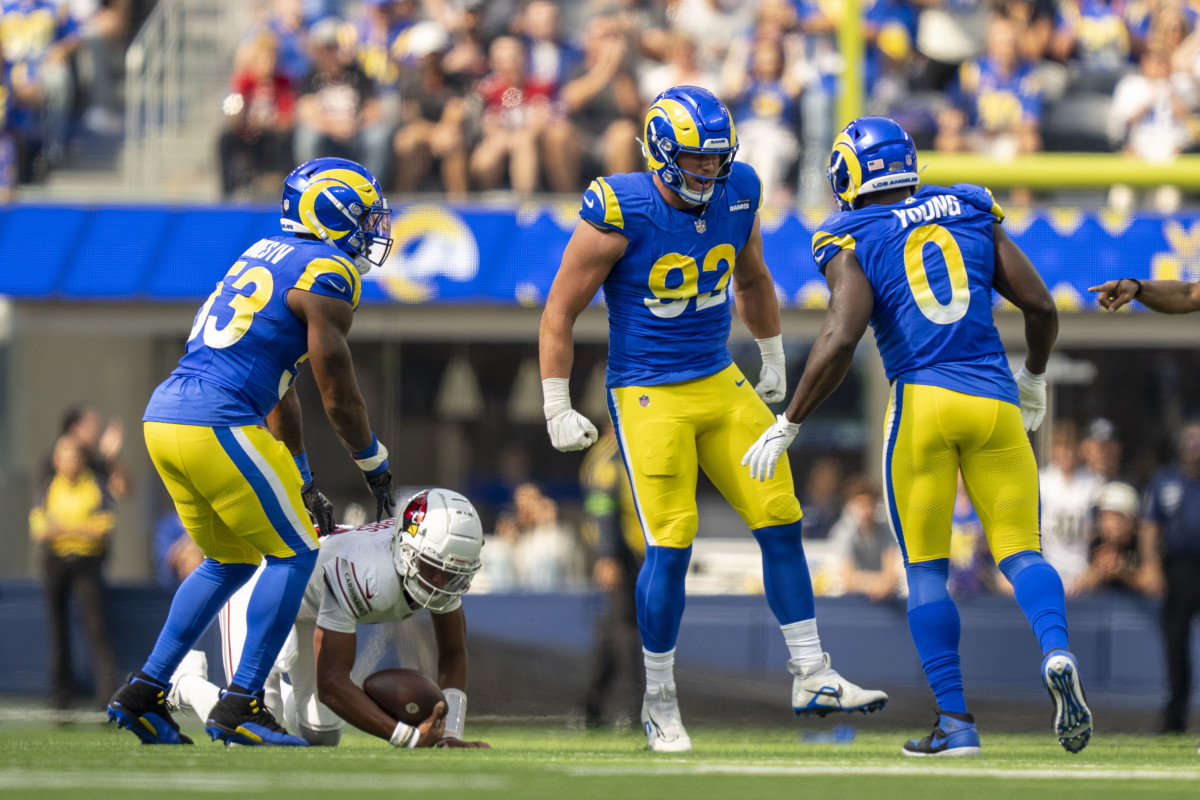 Los Angeles Rams' Ernest Jones (53), Jonah Williams (92) and Byron Young (0) celebrating a sack.