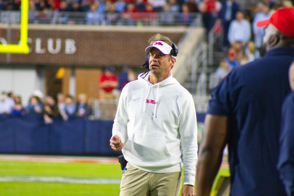 Ole Miss Lane Kiffin stands on the sidlines during the third quarter against Arkansas. 