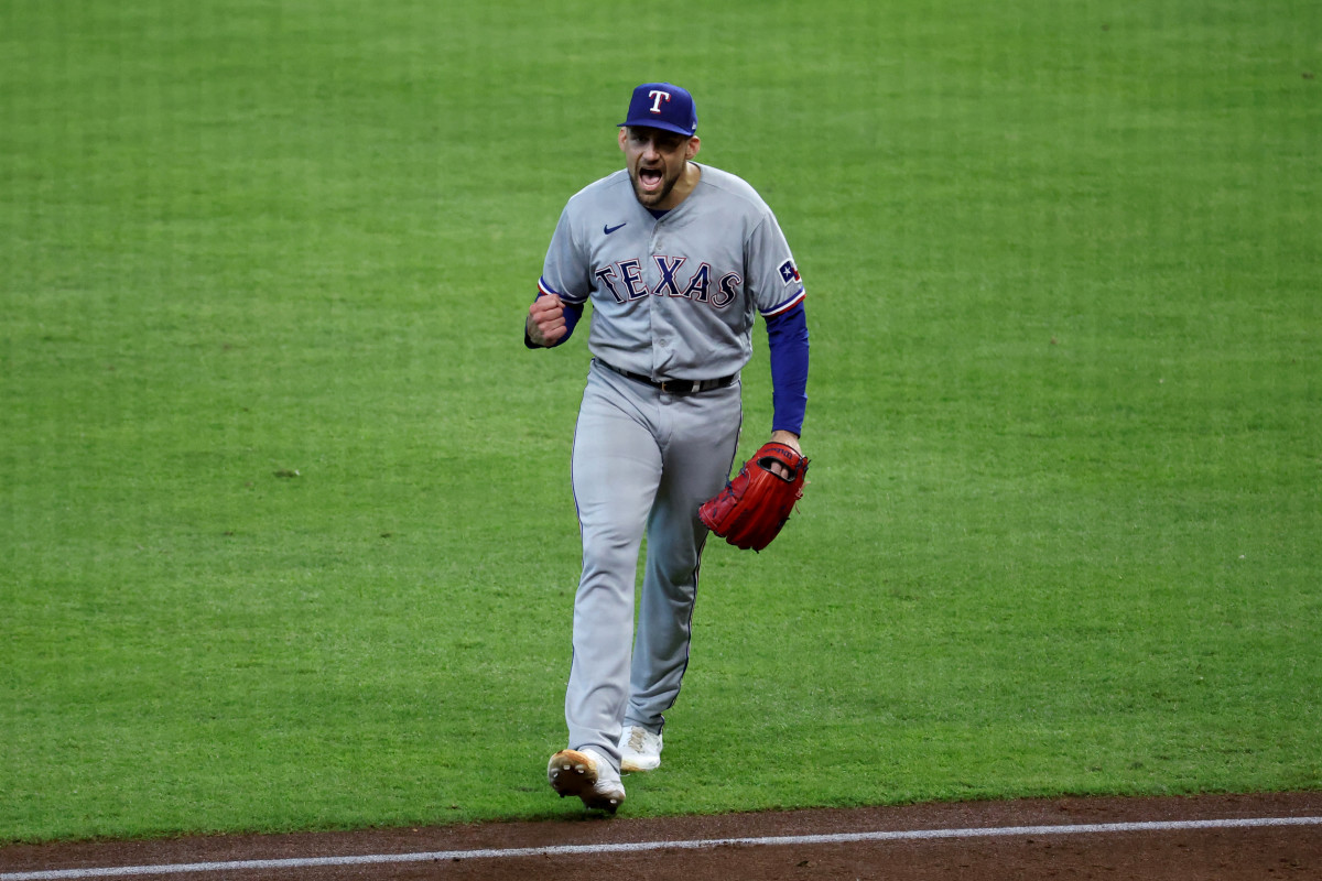 Texas Rangers starting pitcher Nathan Eovaldi reacts after escaping a bases-loaded jam with no outs in the fifth inning against the Houston Astros during Game 2 of the ALCS Monday at Minute Maid Park.