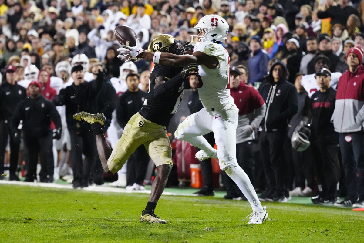 Oct 13, 2023; Boulder, Colorado, USA; Stanford Cardinal wide receiver Elic Ayomanor (13) pulls in a touchdown behind the pack of Colorado Buffaloes cornerback Travis Hunter (12) in overtime at Folsom Field. Mandatory Credit: Ron Chenoy-USA TODAY Sports