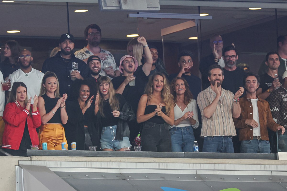 Taylor Swift, actor Ryan Reynolds, actor Hugh Jackman and friends celebrate after a Chiefs touchdown during the first half of Kansas City's game at MetLife Stadium in New York.