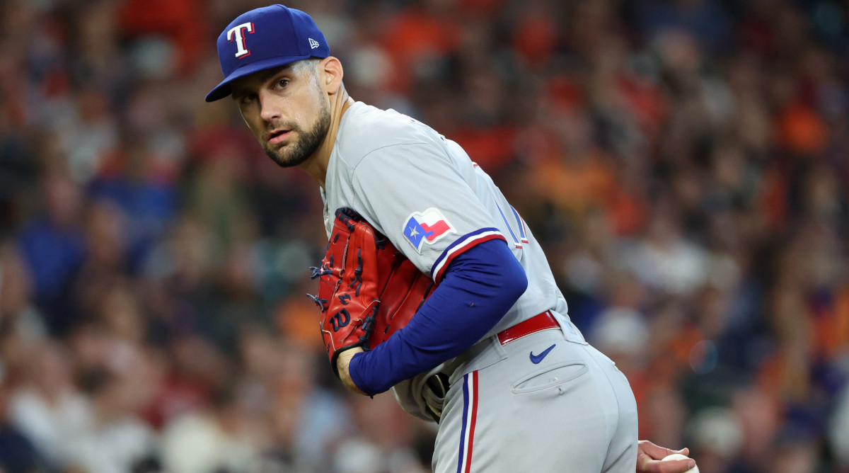 Rangers pitcher Nathan Eovaldi looks over to first from the mound in Game 2 of the 2023 ALCS