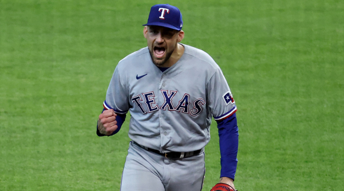 Rangers pitcher Nathan Eovaldi pumps his first after escaping a bases loaded, no outs jam in Game 2 of the ALCS
