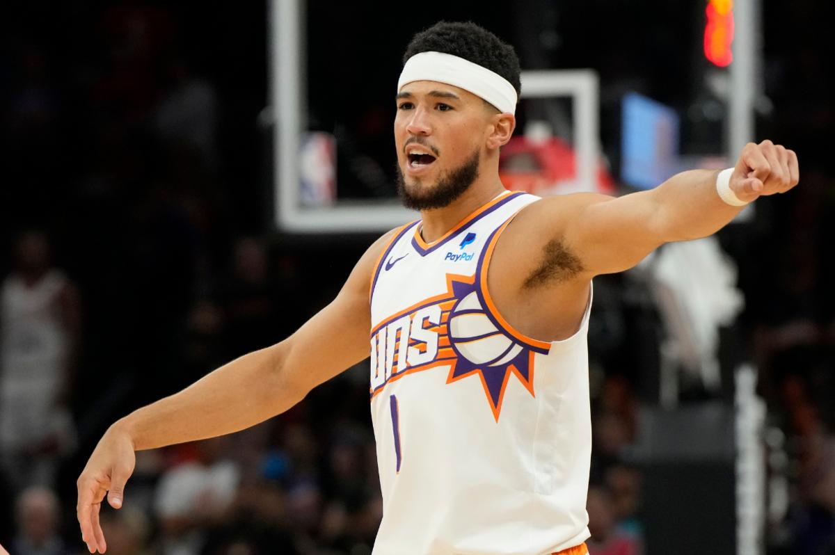 Phoenix Suns guard Devin Booker (1) calls out a play against the Portland Trail Blazers in the first half at Footprint Center.