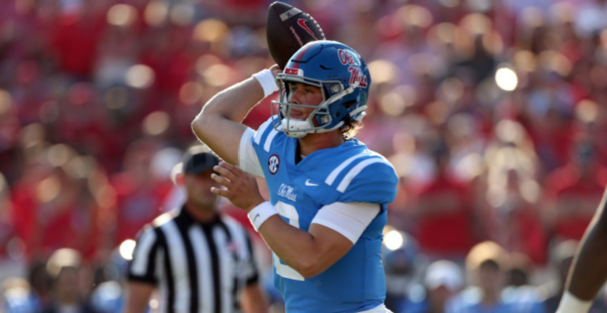 Ole Miss Rebels quarterback Jaxson Dart attempts a pass during a college football game in the SEC.