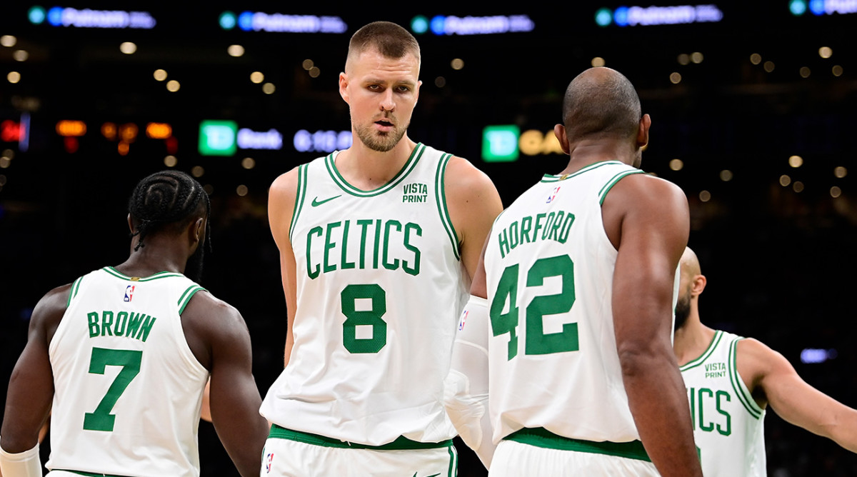 Celtics’ Kristaps Porzingis, Al Horford shake hands.