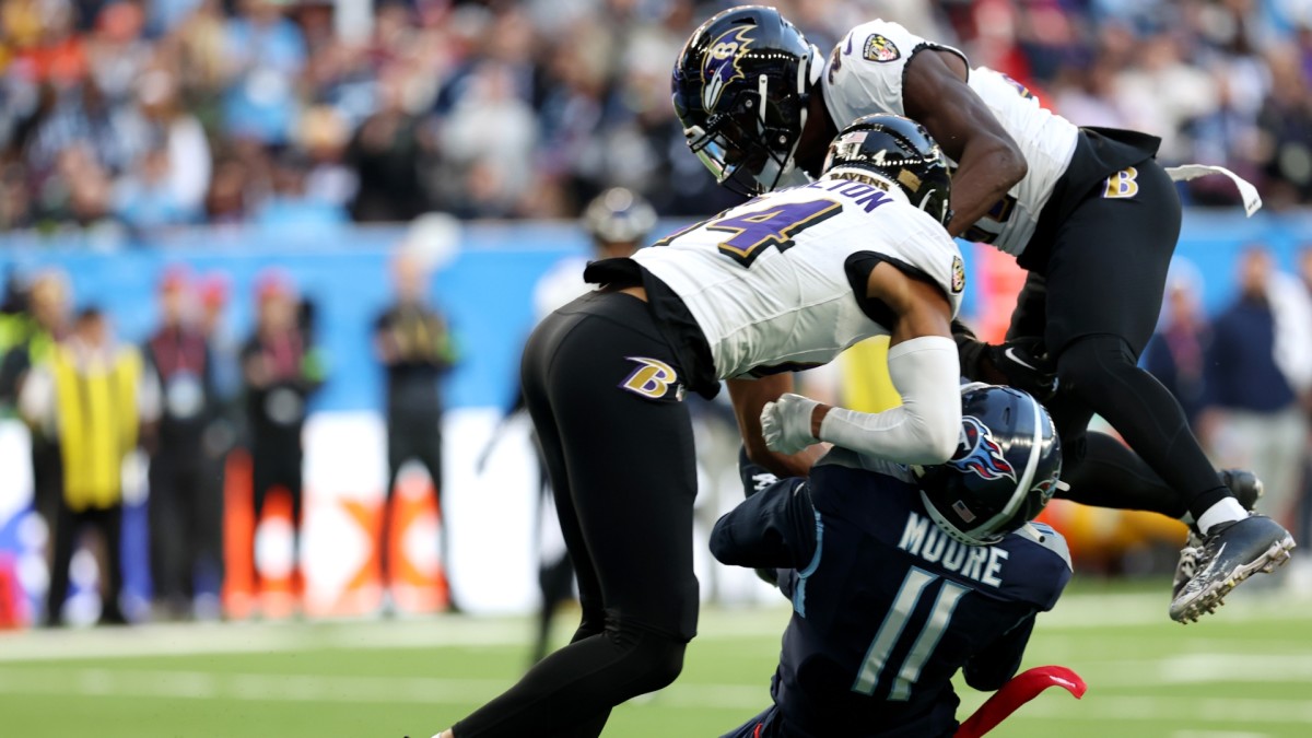 Ravens S Kyle Hamilton hits Titans receiver Chris Moore in the head during the Ravens' 23-16 win in London.