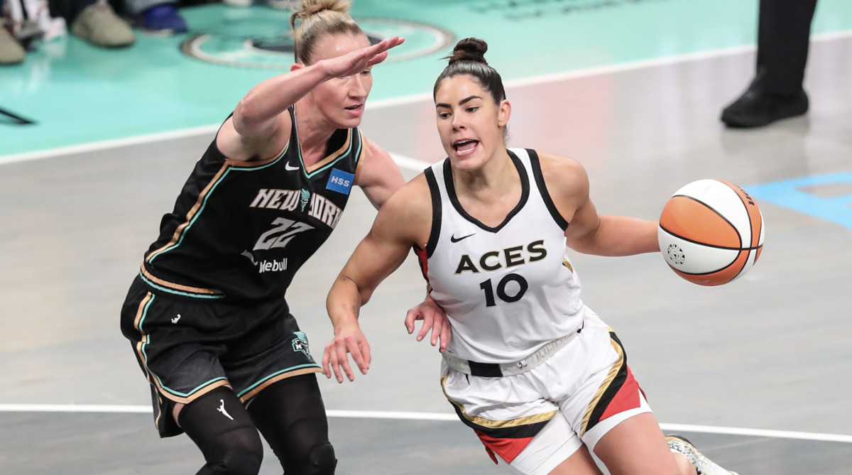 Las Vegas Aces guard Kelsey Plum drives around New York Liberty guard Courtney Vandersloot in the WNBA Finals.