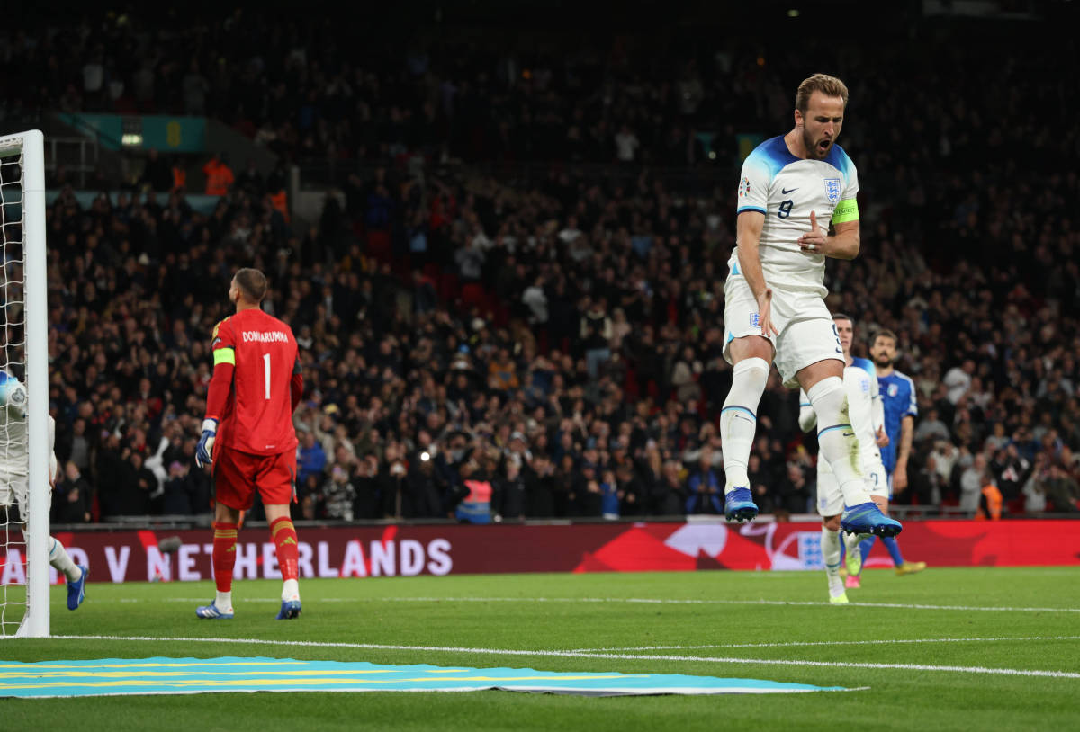 Harry Kane pictured (right) celebrating after scoring the 60th goal of his international career during England's Euro 2024 qualifier against Italy at Wembley Stadium in October 2023