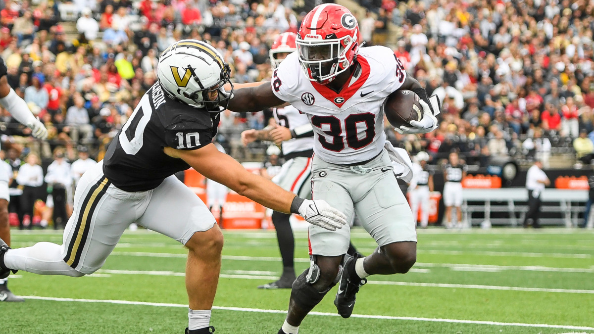 Georgia Bulldogs running back Daijun Edwards stiff arms Vanderbilt Commodores linebacker Langston Patterson.