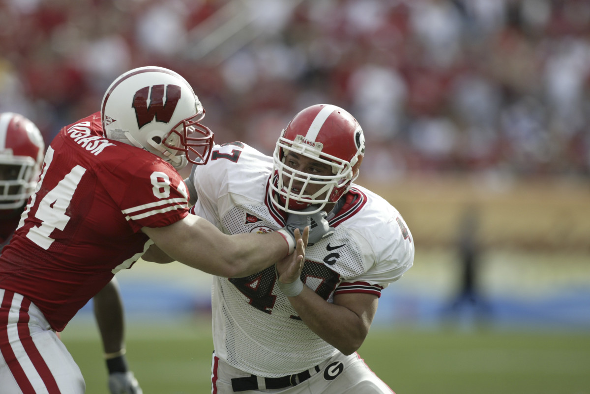 Georgia Bulldogs defensive end #47 David Pollack tries to get around Wisconsin Badgers tight end #84 Coleman Watson in second half action at the 2005 Outback Bowl.The Georgia Bulldogs defeated the Wisconsin Badgers 24-21. Mandatory Credit: Photo By Paul Chapman-USA TODAY Sports Copyright (c) 2005 Paul Chapman