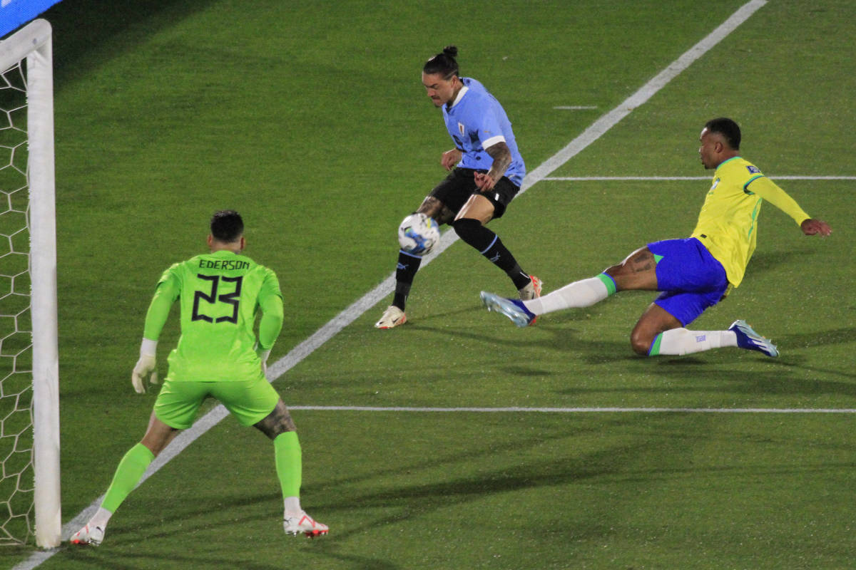 Darwin Nunez pictured (center) crossing the ball to assist a goal for Uruguay in a 2-0 win over Brazil in October 2023