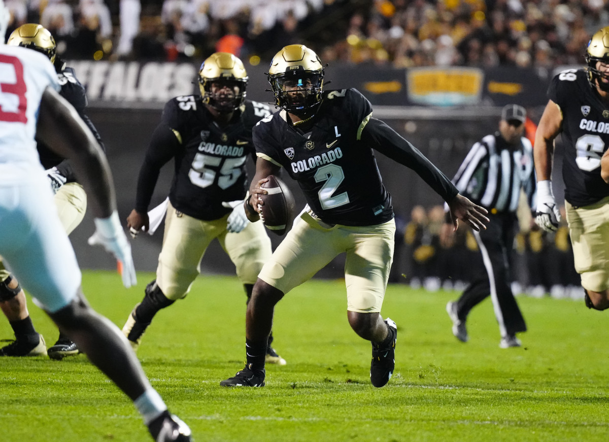 Colorado Buffaloes quarterback Shedeur Sanders (2) scrambles with the ball in the first quarter against the Stanford Cardinal at Folsom Field