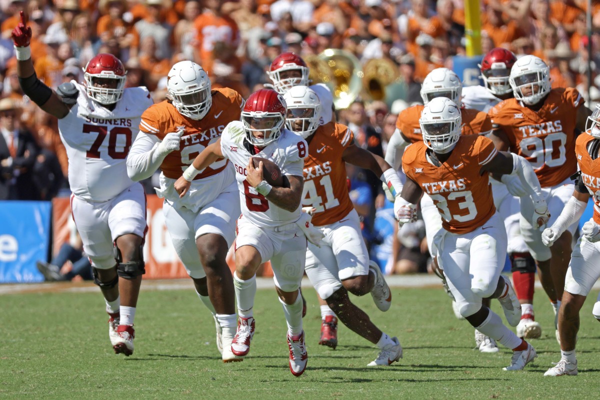 Oklahoma Sooners quarterback Dillon Gabriel runs against the Texas Longhorns.