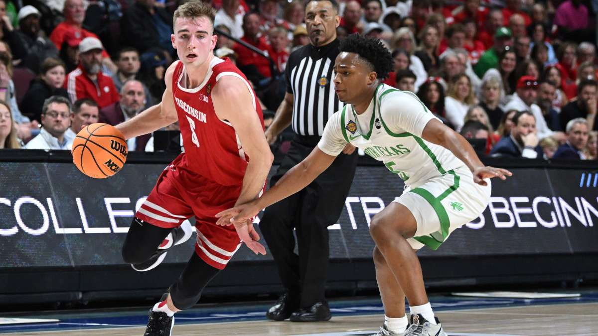 Wisconsin Badgers forward Tyler Wahl dribbles past North Texas Mean Green guard Tylor Perry.