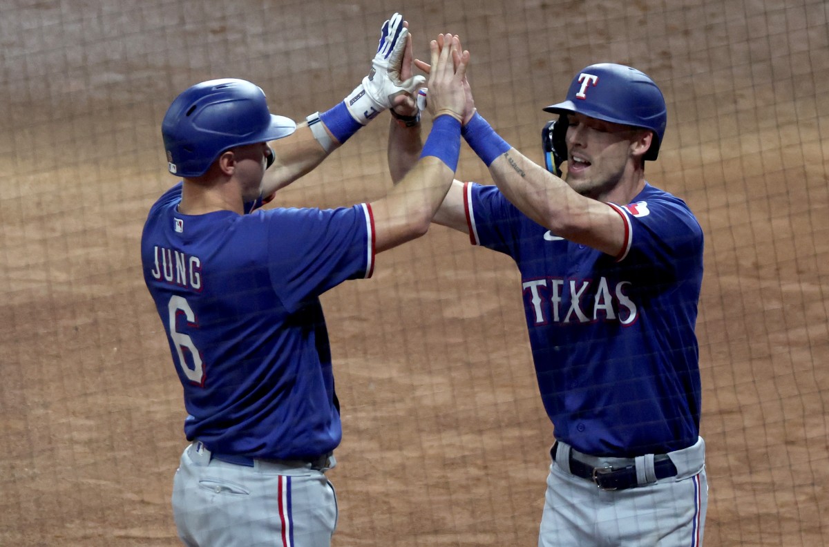 Texas Rangers third baseman Josh Jung and center fielder Evan Carter celebrate