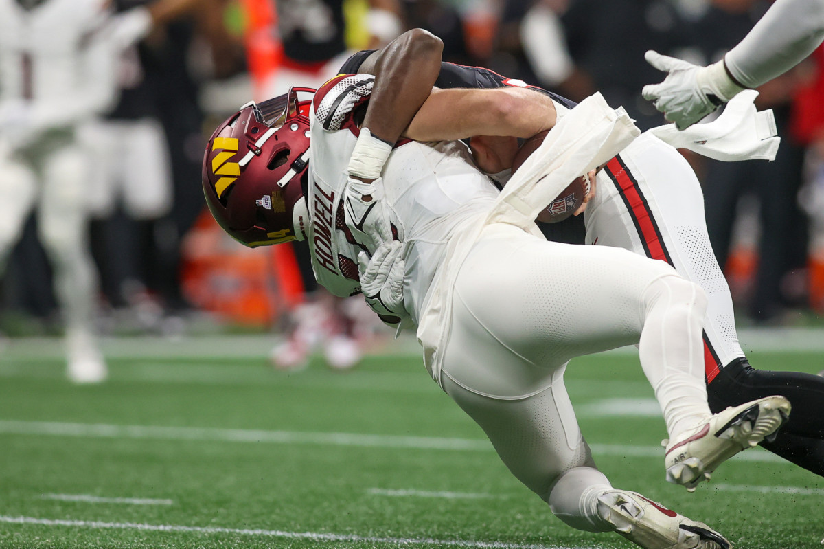 Sam Howell is sacked by a Falcons player