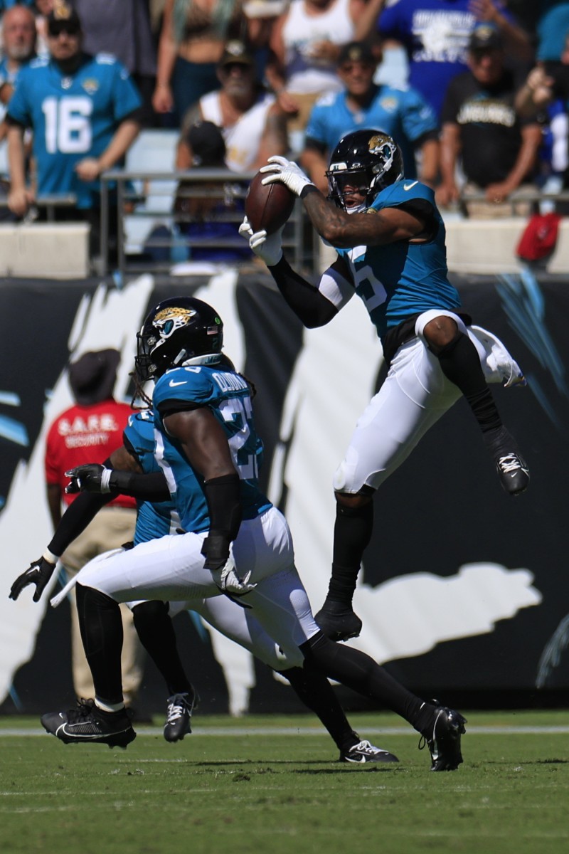 Jacksonville Jaguars safety Andre Cisco (5) hauls in a interception against the Indianapolis Colts. © Corey Perrine/Florida Times-Unio / USA TODAY NETWORK