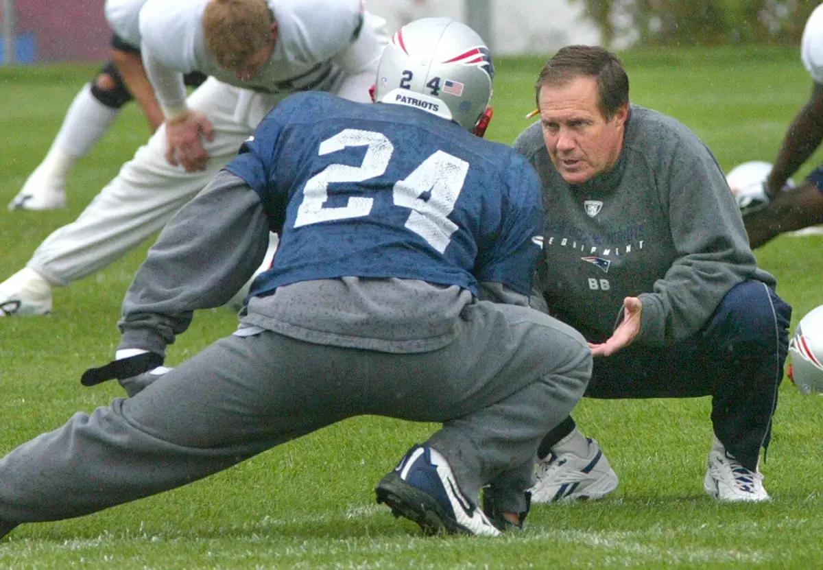 Ty Law and Bill Belichick.
