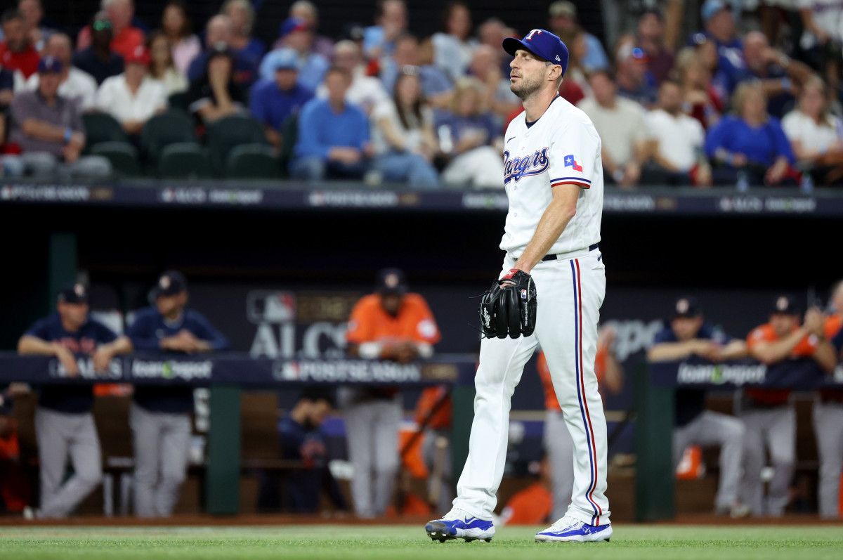 Oct 18, 2023; Arlington, Texas, USA; Texas Rangers pitcher Max Scherzer (31) reacts after a play in the first inning of game three of the ALCS against the Houston Astros in the 2023 MLB playoffs at Globe Life Field. Mandatory Credit: Kevin Jairaj-USA TODAY Sports