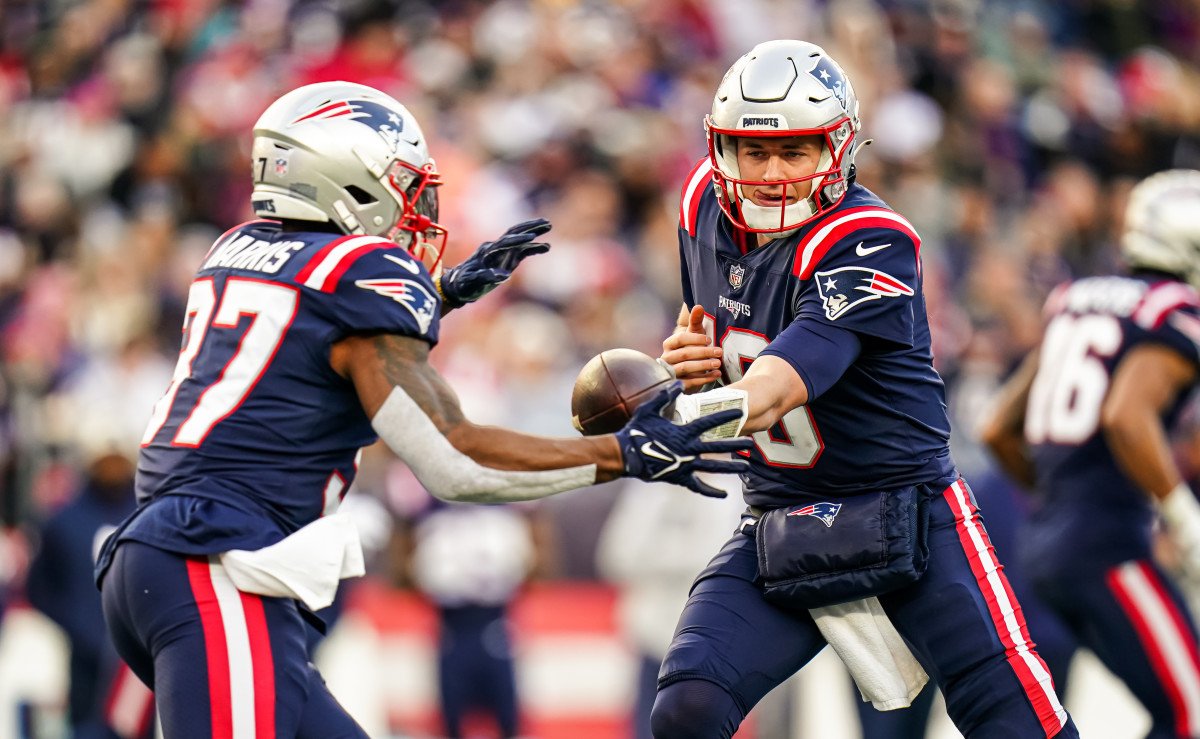 New England Patriots quarterback Mac Jones (10) hands off the ball to running back Damien Harris (37) against the Miami Dolphins in the second half at Gillette Stadium.