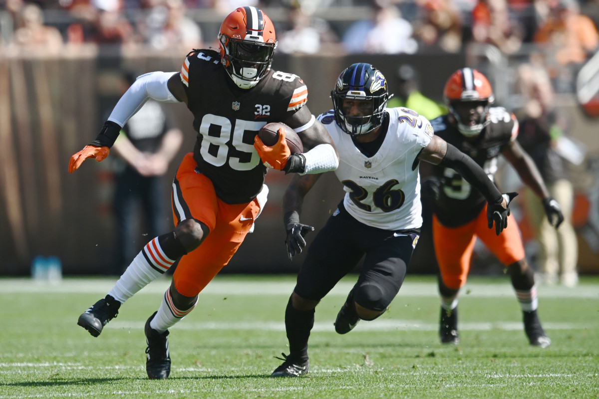 Oct 1, 2023; Cleveland, Ohio, USA; Cleveland Browns tight end David Njoku (85) runs with the ball after a catch as Baltimore Ravens safety Geno Stone (26) defends during the first quarter at Cleveland Browns Stadium.