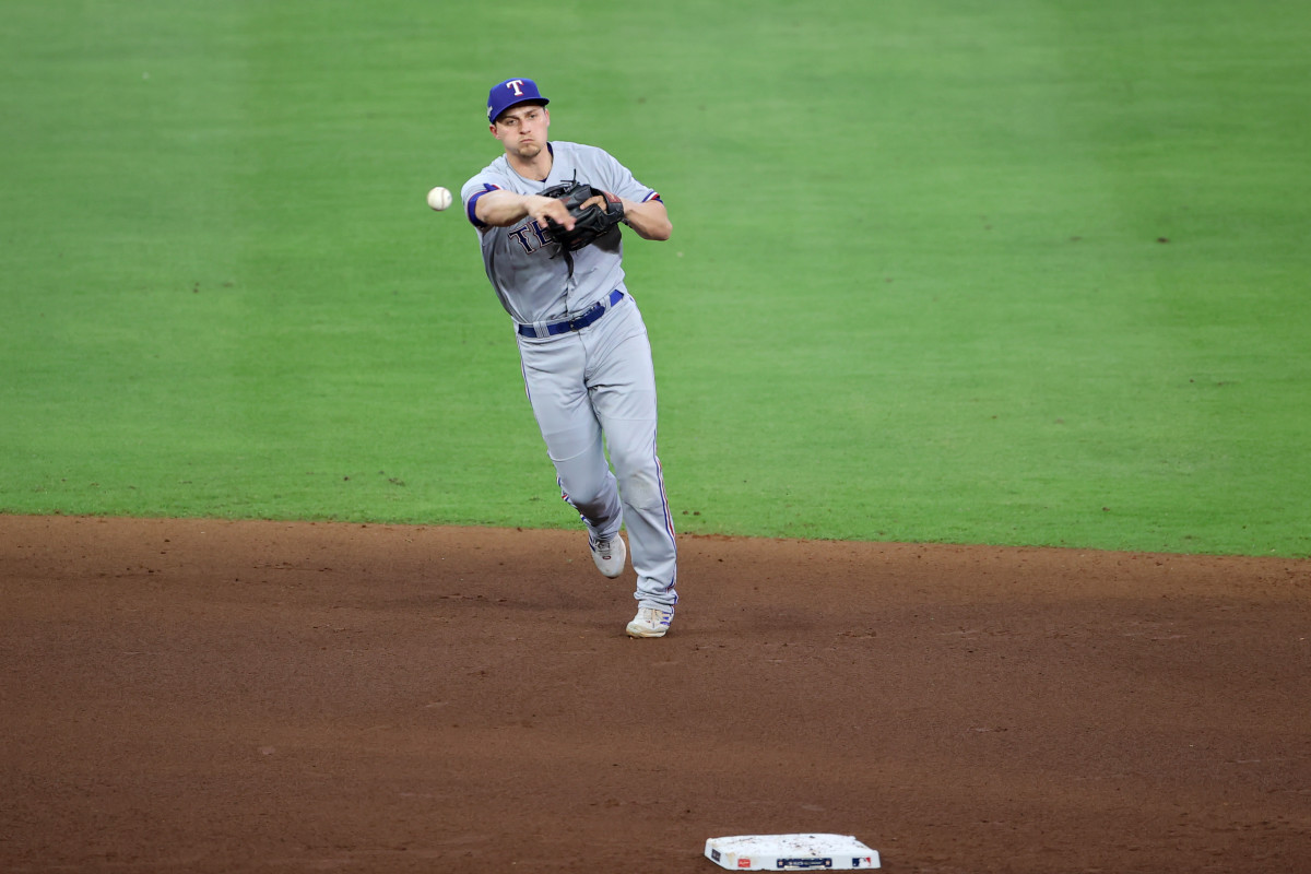 Oct 16, 2023; Houston, Texas, USA; Texas Rangers shortstop Corey Seager (5) throws to first against the Houston Astros in the seventh inning during game two of the ALCS for the 2023 MLB playoffs at Minute Maid Park. Mandatory Credit: Erik Williams-USA TODAY Sports