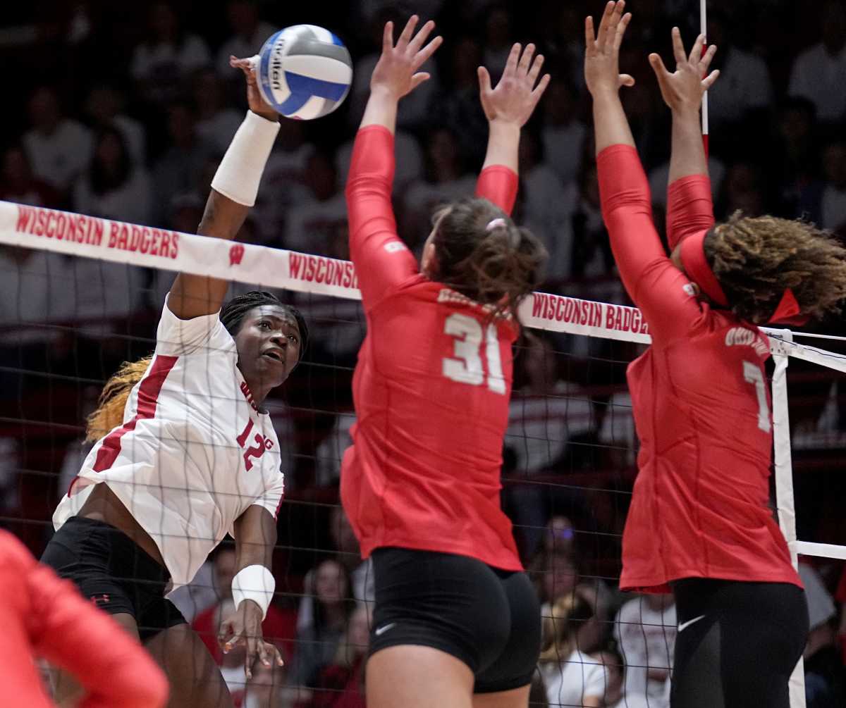 Wisconsin outside hitter Temi Thomas-Ailara (12) hits over Ohio State s Eloise Brandewie (31) during their volleyball match against Ohio State Wednesday, October 18, 2023 at the UW Field House in Madison, Wisconsin.
