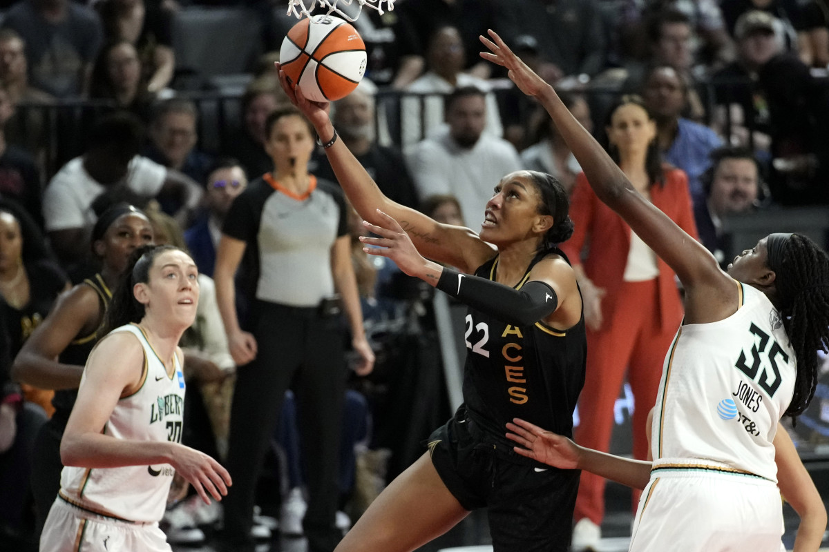 Las Vegas Aces forward A’ja Wilson shoots around New York Liberty players Jonquel Jones and Breanna Stewart during the WNBA Finals.