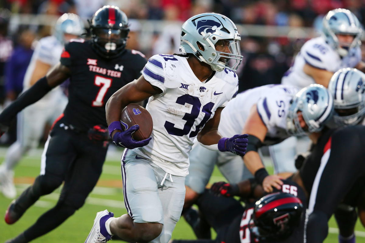 Oct 14, 2023; Lubbock, Texas, USA; Kansas State Wildcats running back Dj Giddens (31) rushes against the Texas Tech Red Raiders in the first half at Jones AT&T Stadium and Cody Campbell Field.