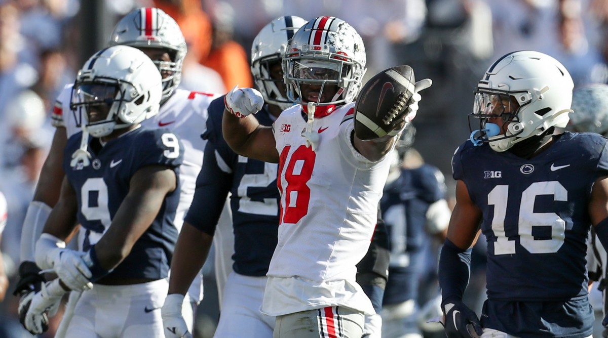 Ohio State wide receiver Marvin Harrison Jr. (18) signals a first down after running with the ball during the fourth quarter of a game against Penn State.