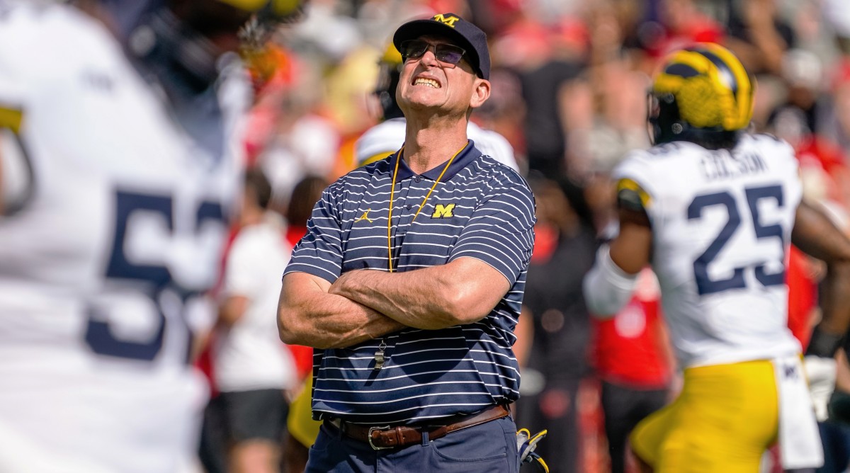 Michigan coach Jim Harbaugh looks on before a game against Nebraska.