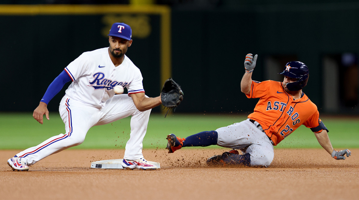 Astros’ Jose Altuve slides into second base vs. the Rangers in ALCS Game 4.