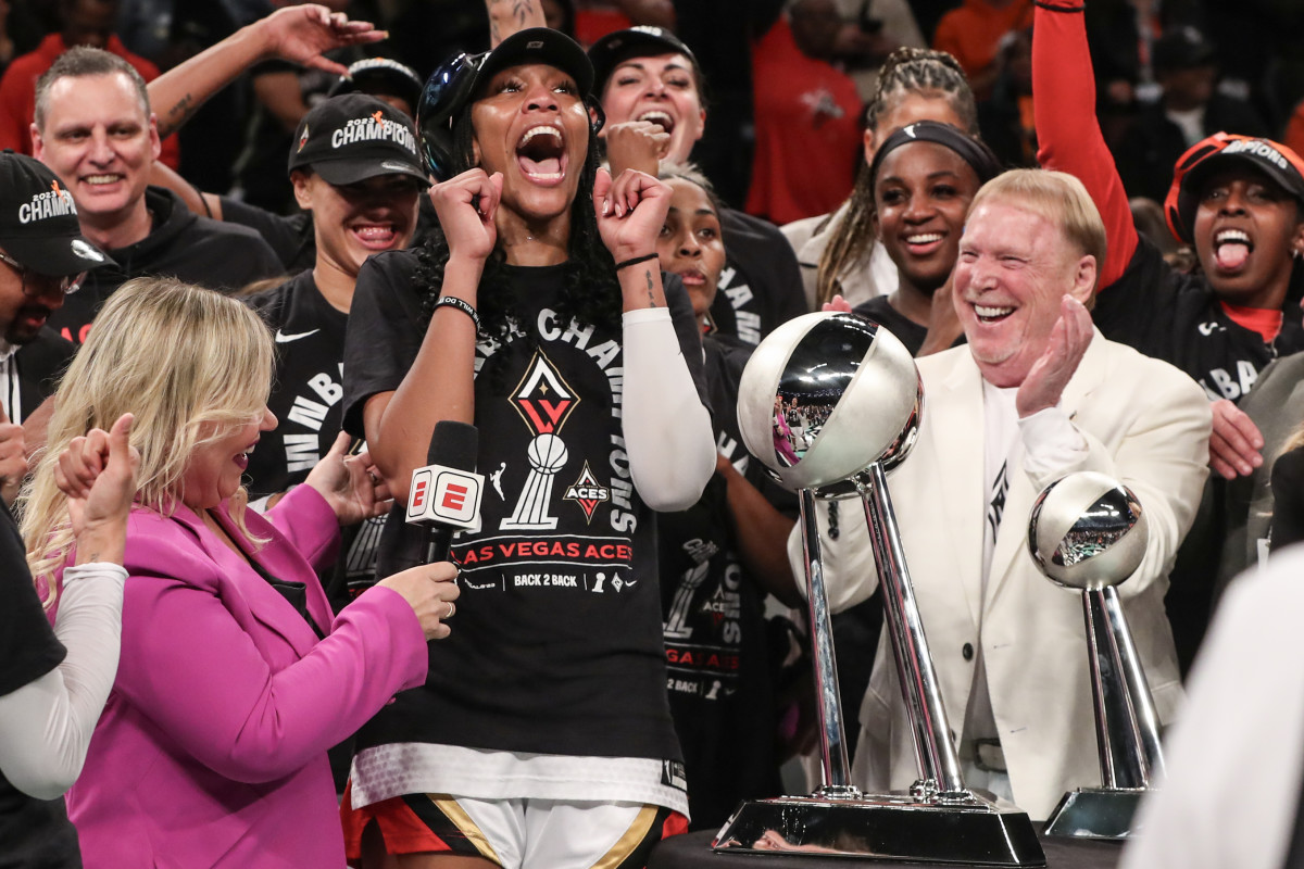 Oct 18, 2023; Brooklyn, New York, USA; Las Vegas Aces forward A'ja Wilson (22) and owner Mark Davis celebrate after winning the 2023 WNBA Finals at Barclays Center. Mandatory Credit: Wendell Cruz-USA TODAY Sports