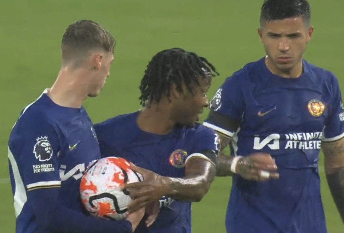 Raheem Sterling pictured (center) trying to take the ball off Chelsea teammate Cole Palmer before a Chelsea penalty kick in a Premier League game against Arsenal in October 2023