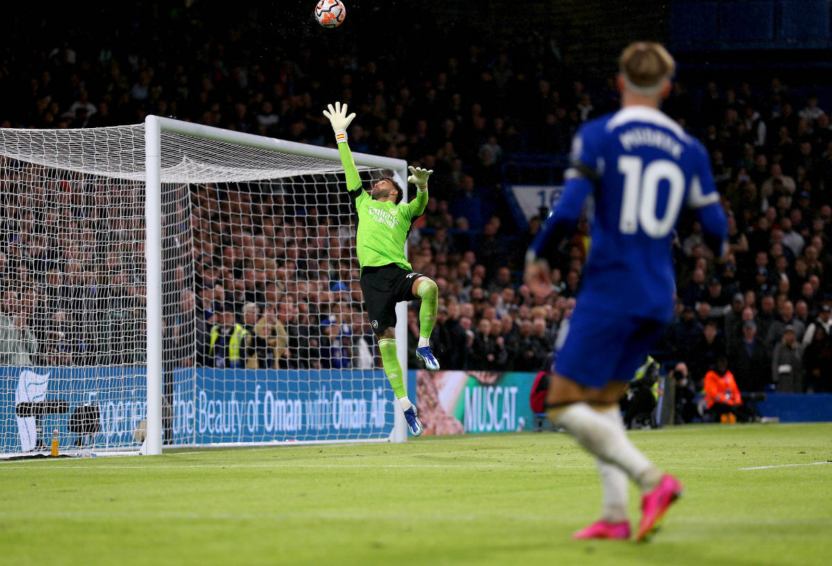 Chelsea winger Mykhailo Mudryk pictured watching on as his mishit cross flies over the head of Arsenal keeper David Raya during an EPL game in October 2023