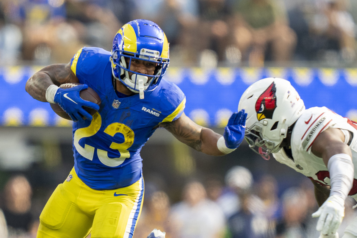 Los Angeles Rams running back Kyren Williams (23) runs the football against Arizona Cardinals cornerback Marco Wilson (20) during the third quarter at SoFi Stadium.