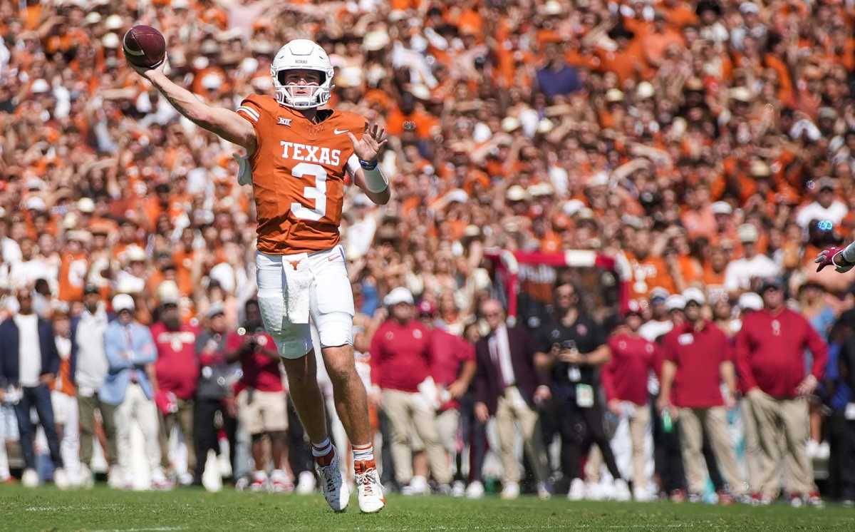 Texas Longhorns quarterback Quinn Ewers (3) passes for the touchdown in the second quarter against Oklahoma Sooners defense during an NCAA college football game at the Cotton Bowl on Saturday, Oct. 7, 2023 in Dallas, Texas. 
