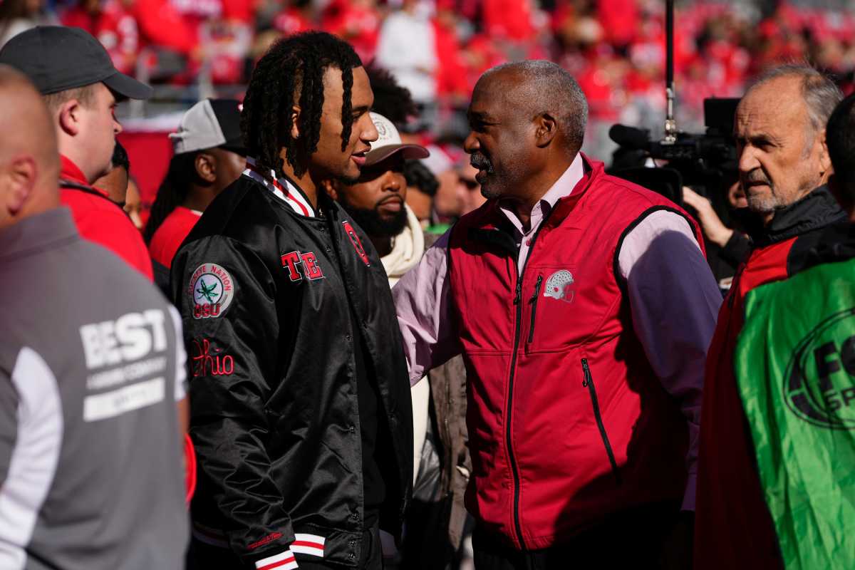 Oct 21, 2023; Columbus, Ohio, USA; Former Ohio State Buckeyes quarterback CJ Stroud, now with the Houston Texans in the NFL, talks to Gene Smith on the sideline prior to the NCAA football game at Ohio Stadium.