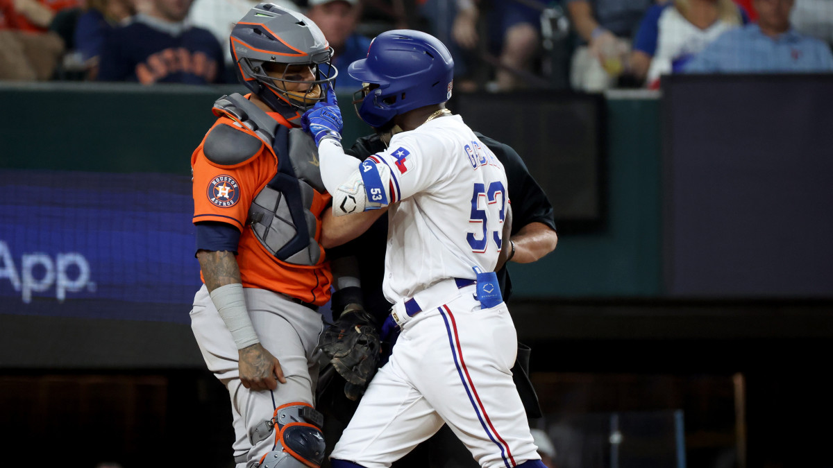 Texas Rangers right fielder Adolis Garcia confronts Houston Astros catcher Martin Maldonado.