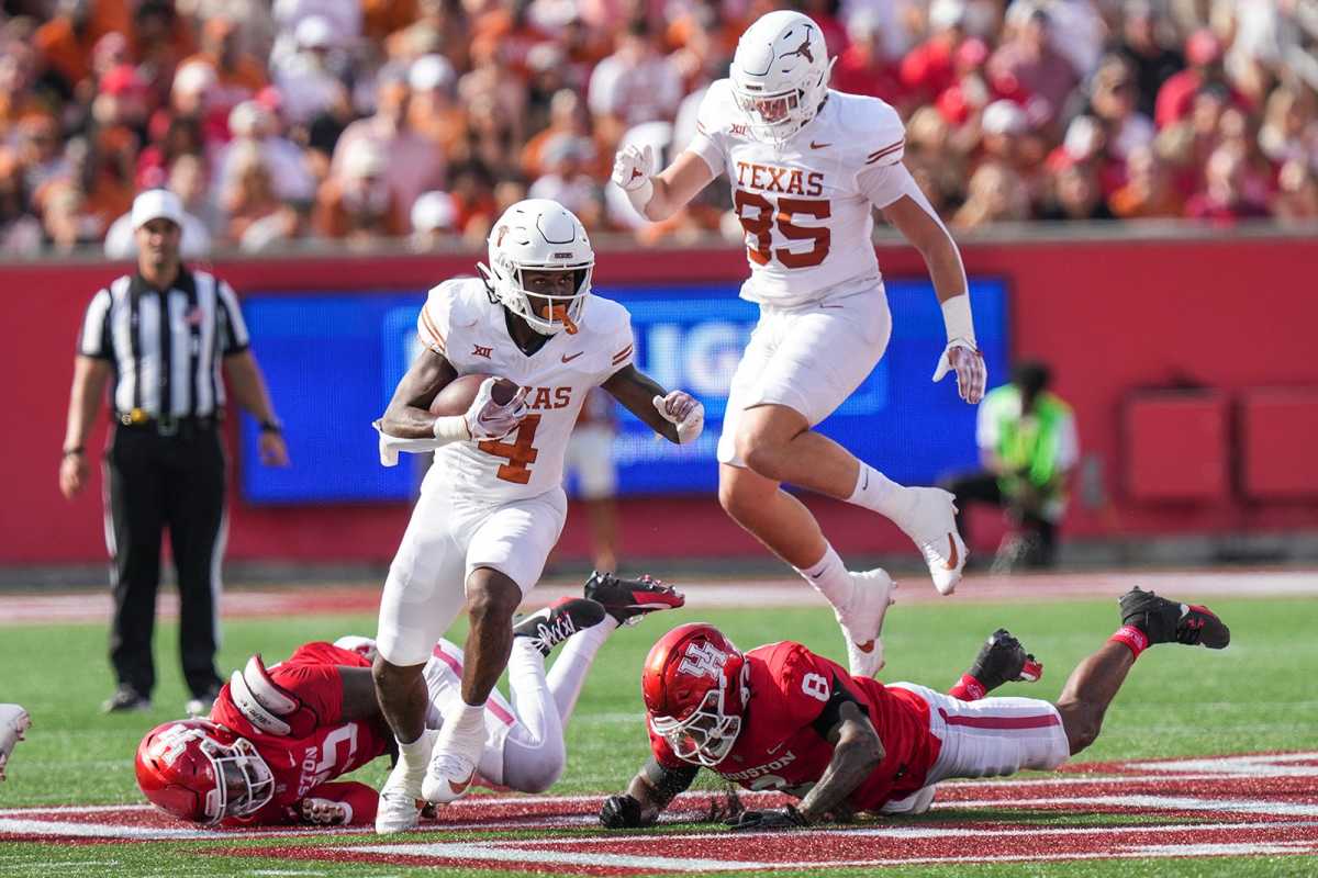 Texas running back CJ Baxter (4) carries the ball forward during the Longhorns game against the University of Houston at TDECU Stadium on Saturday, Oct. 21, 2023.