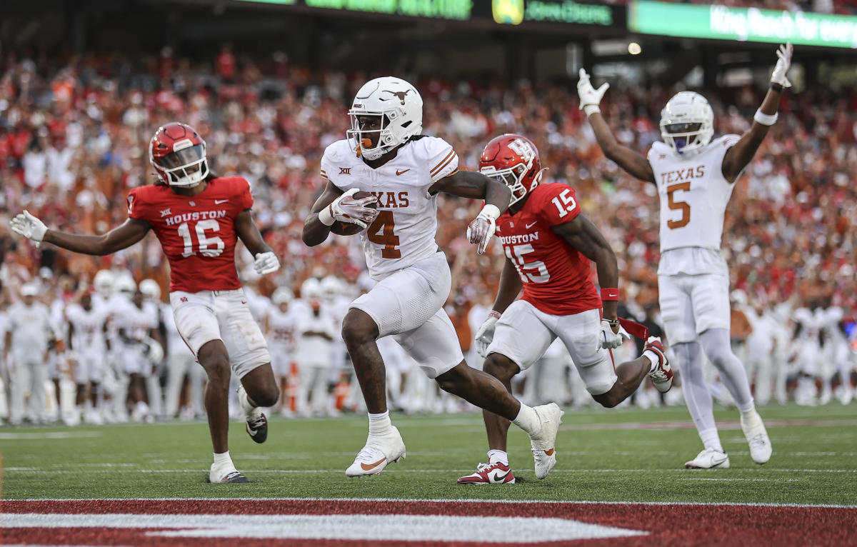 Oct 21, 2023; Houston, Texas, USA; Texas Longhorns running back CJ Baxter (4) runs with the ball and scores a touchdown during the fourth quarter against the Houston Cougars at TDECU Stadium. 